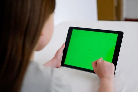 Digital tablet with empty black screen. Young girl holding tablet pc in her h Stock Photos