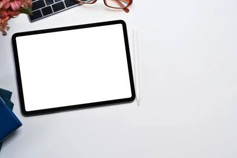Digital tablet with empty screen, stylus pen, keyboard and glasses on white Stock Photos