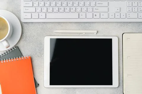 Digital tablet with empty screen on table with business accessories Stock Photos