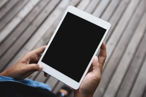 Digital tablet in hand on top angle view Stock Photos