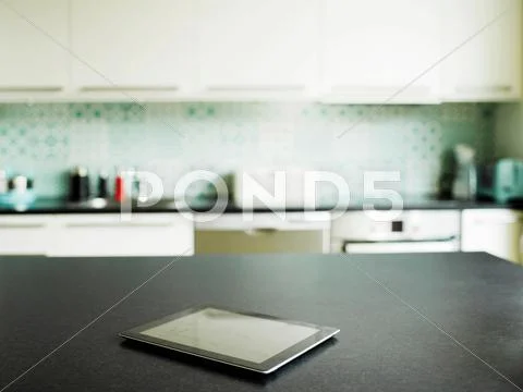 Digital Tablet On Kitchen Counter