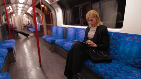 Digital tablet on London Underground train Stock Footage 40262287
