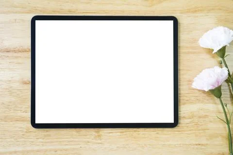 Digital tablet mockup on office working table Stock Photos