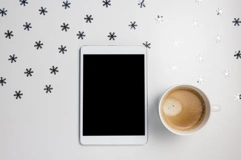 Digital tablet mockup on winter background with snowflakes and coffee Stock Photos