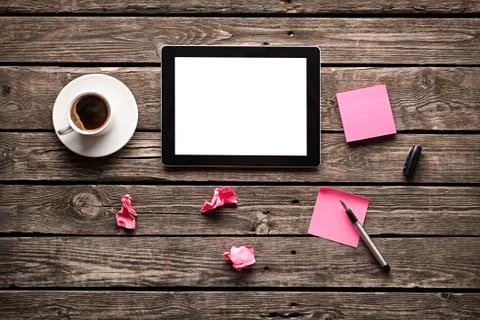 Digital tablet with note paper and cup of coffee Stock Photos