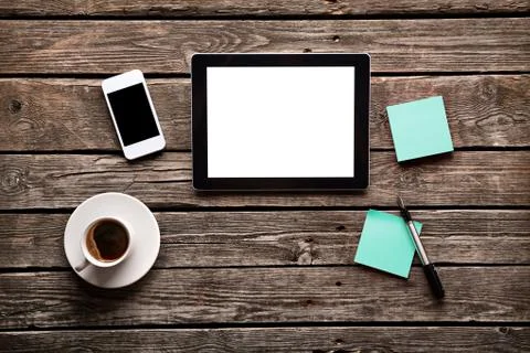 Digital tablet with note paper and cup of coffee Stock Photos