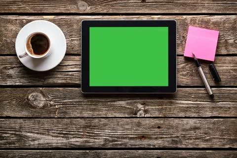 Digital tablet with note paper and cup of coffee 写真素材