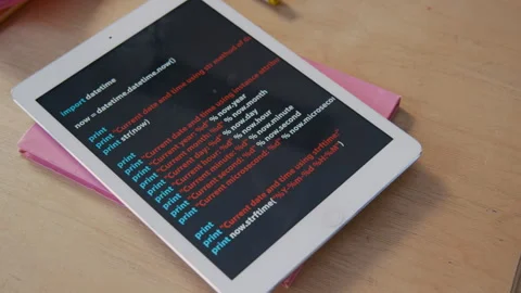 Digital Tablet with Programming Code on Desk in Classroom Stock Footage 306927694