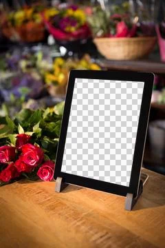Digital tablet on table with flowers Stock Illustration
