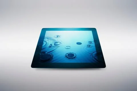 Digital tablet with water drop effect on screen Stock Photos