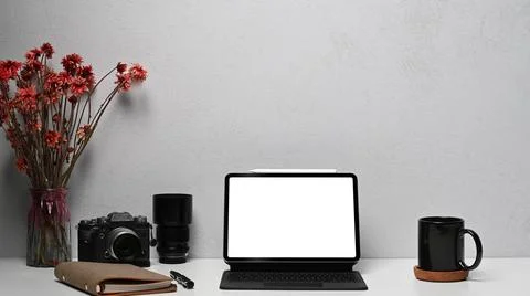 Digital tablet with wireless keyboard, camera, notebook and coffee cup on white Stock Photos