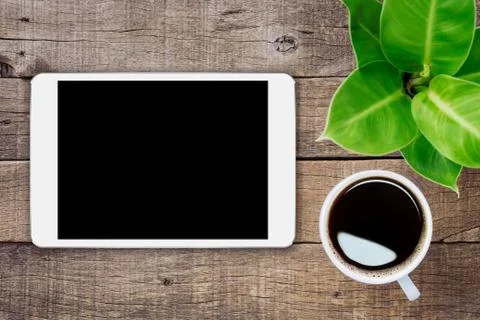 Digital tablet on wood table top view, mock-up white tablet blank screen fo.. Stock Photos