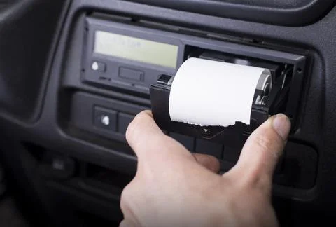 Digital tachograph with an open printer and visible roll of paper. Paper roll Foto stock