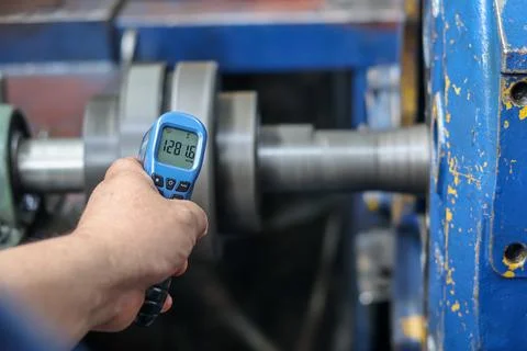 Digital Tachometer Measuring Rotation Speed of Industrial Shaft. Stock Photos