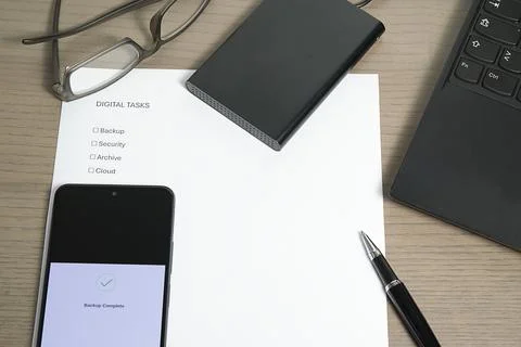 Digital Task Checklist and Phone Backup Close-up Stock Photos