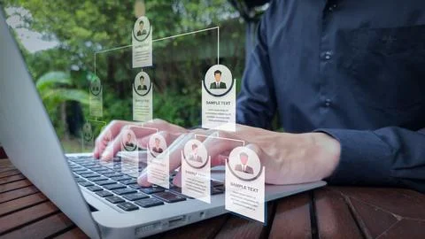 Digital Team Structure Visualization with Laptop and Organizational Chart Stock Photos