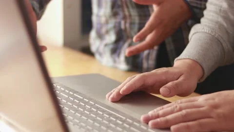 Digital team working on computer laptop, two programmer doing web internet  Stock Footage 148087962