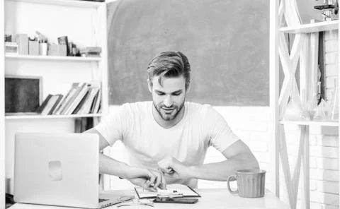Digital technology. Apply online programming course. Handsome man use modern Stock Photos