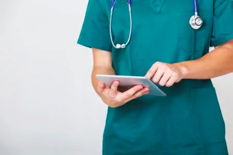 Digital technology with Doctor using tablet with white background. Stock Photos