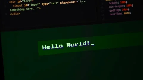 Digital terminal displaying "Hello World!" message against  coding background Stock Footage 320777590