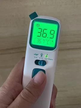 Digital Thermometer in Hand Stock Photos