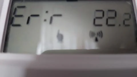 Digital thermostat display showing error message and temperature Stock Footage 333779638
