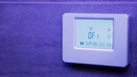 Digital thermostat that is linked to smart lights is changed from on to off Stock Footage 201261202