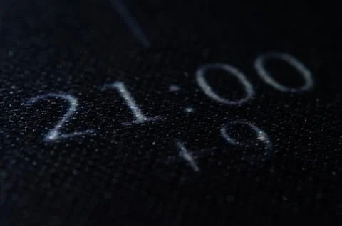Digital Time Display 21:00, Glowing Numbers on Dark Textured Surface - Midn.. Stock Photos