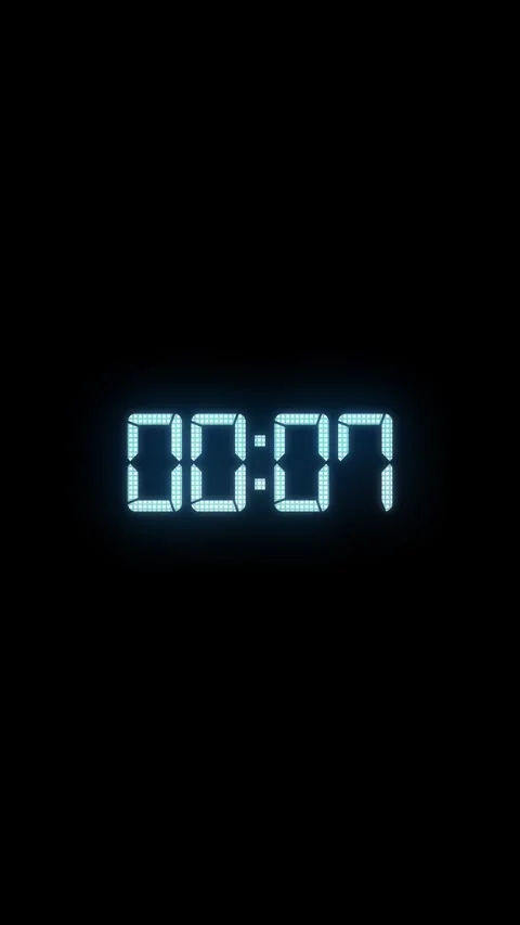 Digital timer countdown with glowing cyan segmented clock text on black space. w Stock Footage 340556213