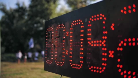 Digital timer. Counter. close-up. black light board, with red numbers of small Vidéo 166021620