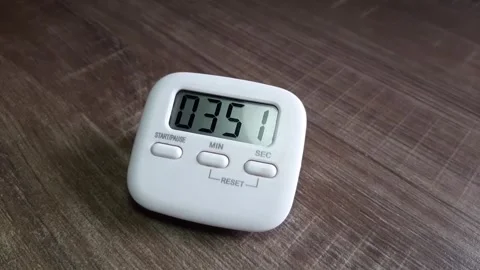 Digital timer counting down on the working desk Stock Footage 285911525