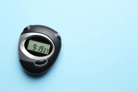 Digital timer on light blue background, top view. Space for text Foto stock