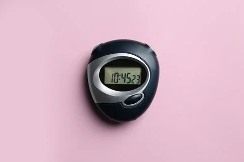 Digital timer on pink background, top view Stock Photos