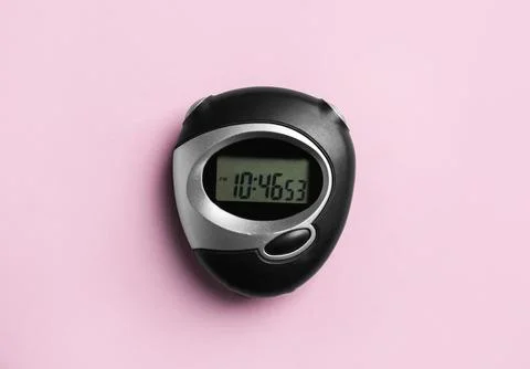 Digital timer on pink background, top view Stock Photos