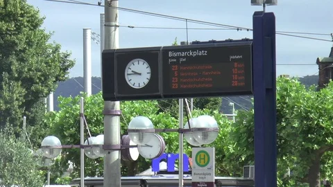Digital Train Sign With Clock at Bismarckplatz in Heidelberg Stock Footage 82930666