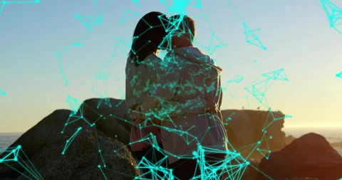 Digital turquoise tech network sweeping coastal sunset, drifting nodes revealing Stock Footage 314173108