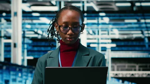 Digital twin virtualization, laptop and happy employee in data center Stock Footage 329532759