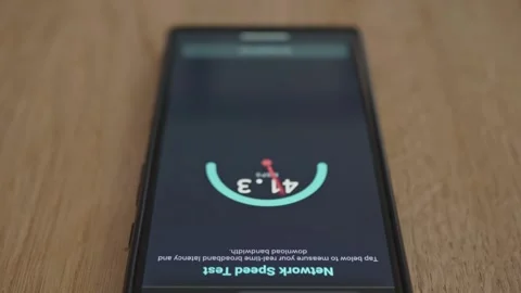 Digital UI on smartphone screen measuring data connection speed Stock Footage 337998736