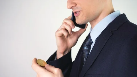 Digital virtual currency concept and symbol. Man is holding and buying, selling  Stock Footage 125195359