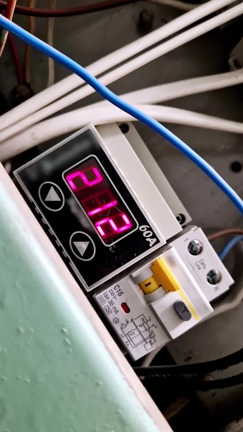 Digital Voltage Meter and Circuit Breaker in Electrical Panel Stock Footage 321941949