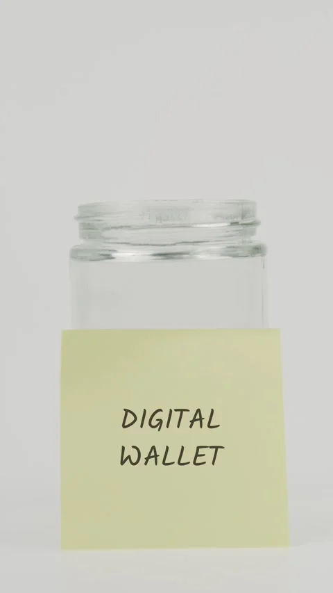 Digital wallet text or word on yellow sticky note attached to glass jar Stock Footage 311717728