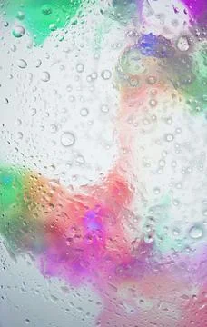 Digital wallpaper with an abstract pattern of water drops on a multicoloure.. Stock Photos