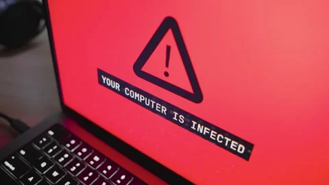Digital warning message alerts on potential cyber threat affecting laptop Stock Footage 343424206