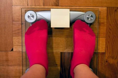 Digital weight scale with post it note covering screen Stock Photos