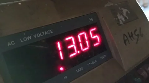A digital weighting machine display with increasing weight   Stock Footage 168412690