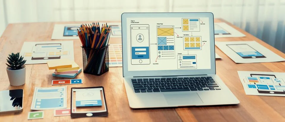 Digital wireframe design for web or mobile app UI on laptop. Scrutinize Stock Photos