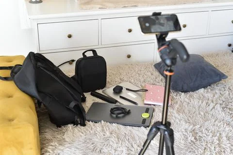 Digital work equipment on rug with iPhone on tripod Stock Photos