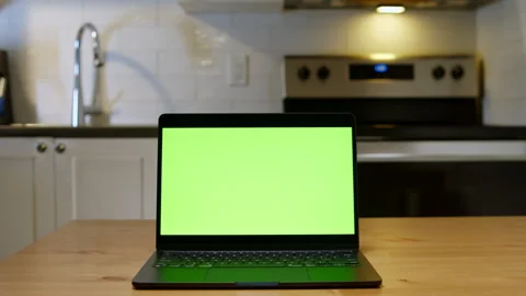 Digital Workspace Setup With Green Screen Laptop In Kitchen Interior Shot Stock Footage 315355472