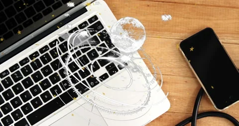 Digital workspace showing rotating HUD elements on silver keyboard, featuring Stock Footage 307450602
