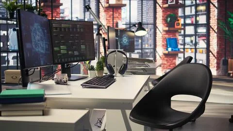 Digital workstation features multiple PC monitors running artificial Stock Photos
